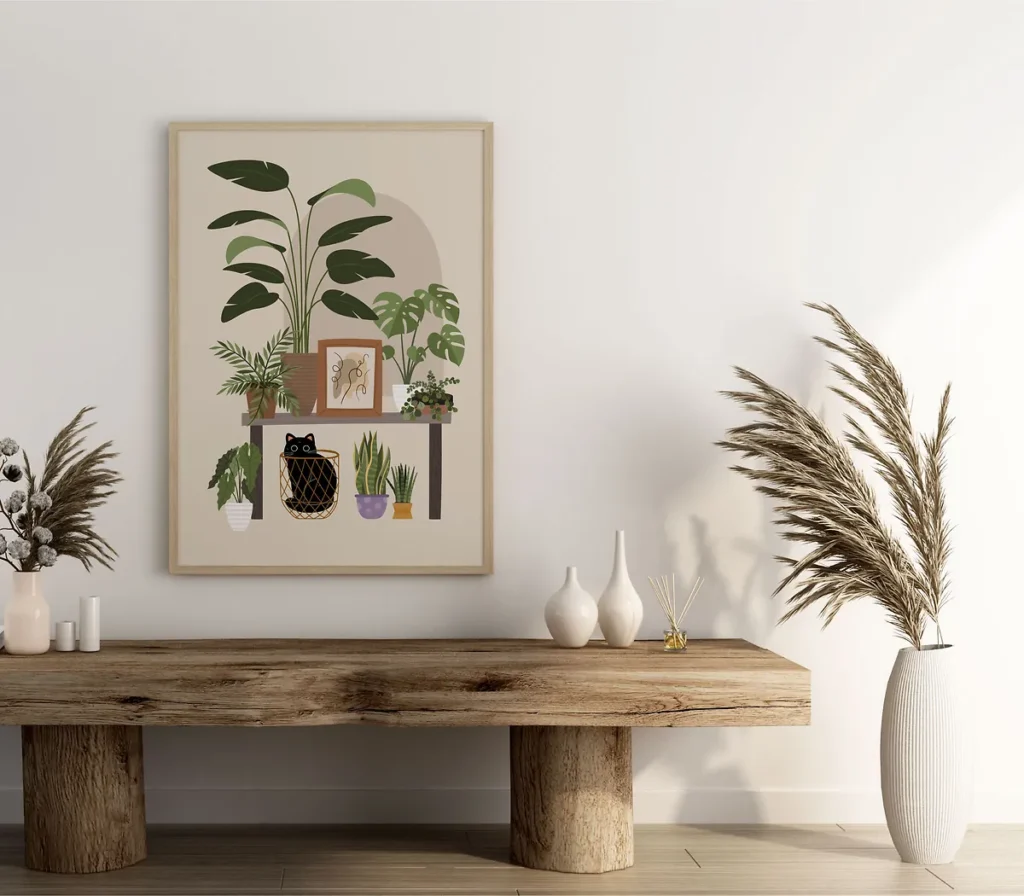 Framed botanical poster art featuring a naughty black cat hiding among large green monstera leaves and houseplants in a boho-style wooden frame
